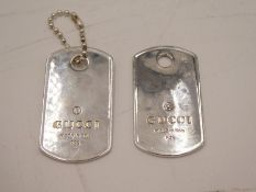 A pair of silver luggage tags stamped Gucci, made in Italy, total weight approx 1.18ozt