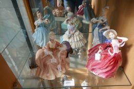 Five Royal Doulton figures to include Day Dreams and Autumn Breezes (5)