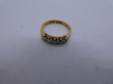 18ct yellow gold diamond set ring, 5 diamonds, the largest approx 0.10 carat, marked 750, size J/K,