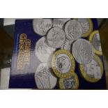 Two albums of modern commemorative coins, some silver proof examples, denominations from £5 to 50p