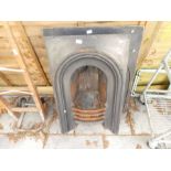 Two similar Victorian cast iron fireplaces
