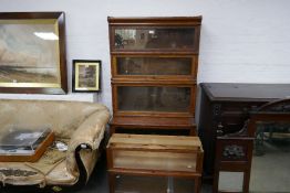 An old oak Globe Wernicke four section bookcase with two additional similar section (6)