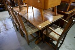 A reproduction oak refectory table and a set of six matching chairs