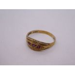 9ct yellow gold gypsy ring set with three small rubies, marked 375, size P, 1.7g approx. Gold conten