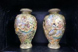 A pair of 20th century Japanese Satsuma vases decorated figures, 30.5cms