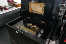 A Victorian inlaid music box playing six Airs with five bells on later stand