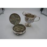 A very decorative Victorian half reeded and embossed two handled cup on a square foot. Foliate detai