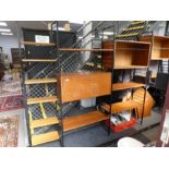 A quantity of Staples Ladderax unit furniture on black metal ends, with some corner shelves