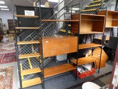 A quantity of Staples Ladderax unit furniture on black metal ends, with some corner shelves