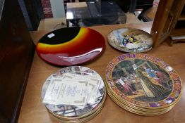 A Poole 'Eclipse' charger and a quantity of Royal Doulton collectors plates