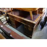 A late Victorian mahogany twin pedestal desk having nine drawers