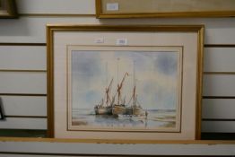 David Eddington, two watercolurs of boats and figures on beach, signed and one other watercolour of