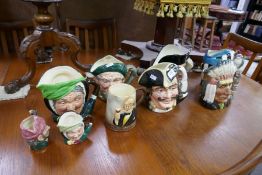 A quantity of Royal Doulton character jugs and a Falcon wear tankard, (9)