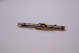 Antique 9ct yellow gold bar brooch with three gate decoration and applied floral detail set single a