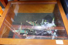 A quantity of model planes in display case and a model boat