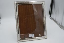 An attractive silver hammered design photo frame 22cm x 28cm approx. Stamped 925 most probably Itali