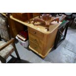 A reproduction oak twin pedestal dressing table having six drawers