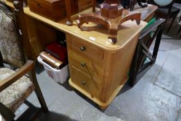 A reproduction oak twin pedestal dressing table having six drawers