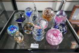 A shelf of paperweights