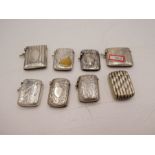 A large quantity of seven silver vestas of various designs and hallmarks. One having gilted vacant c