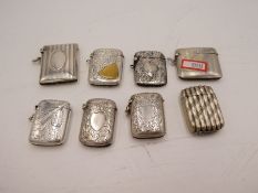 A large quantity of seven silver vestas of various designs and hallmarks. One having gilted vacant c