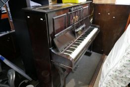 A Victorian iron framed upright piano by Berry, London
