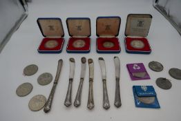 A quantity of six silver handled knives, hallmarked Sheffield 1913 John Biggin. Also with silver coi