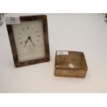 A silver rectangular framed clock by Kitney and Co, London, also with a worn silver cigarette box wi