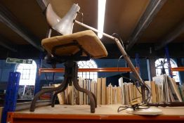 An anglepoise lamp and an industrial revolving chair