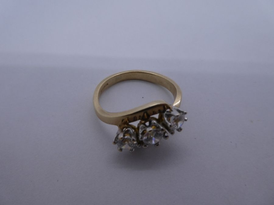 9ct yellow gold dress ring of crossover design inset three clear stones, Size N/O, 3.8g approx - Image 2 of 3