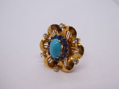 18ct yellow gold dress ring in the form of a flower head, inset with turquoise, blue and clear stone