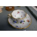 A 19th century, Meissen floral encrusted cup saucer