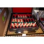 Chess board and cased set of chess men