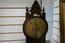 An early 20th century Admiral Fitzroy's barometer having carved oak case with circular dial