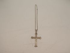 A large silver cross with engraved decorative pattern. Stamped 925, on a sterling chain. 1.01ozt app