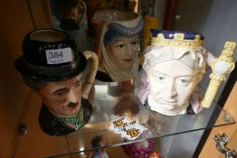 Three Royal Doulton character jugs to include Queen Victoria, King Arthur and Guinevere, and Charlie