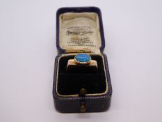 Unusual design yellow gold dress ring with squared shoulders and oval opal with blue and green hues,