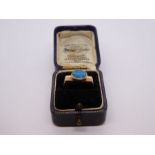 Unusual design yellow gold dress ring with squared shoulders and oval opal with blue and green hues,