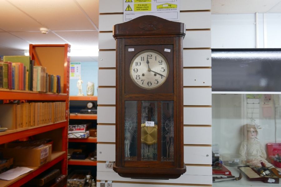 A 1930's oak hanging wall clock