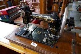 An antique 'New White Peerless' sewing machine