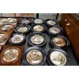 Eleven Victorian pot lids in ebonized circular frames
