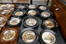 Eleven Victorian pot lids in ebonized circular frames
