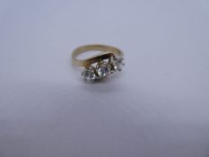 9ct yellow gold dress ring of crossover design inset three clear stones, Size N/O, 3.8g approx