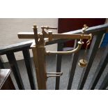 A set of brass and oak stand on weighing scales with adjustable brass measuring stick, by W & T Aver