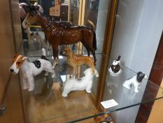 A Beswick brown horse, four dog ornaments and a Royal Crown Derby bird paperweight