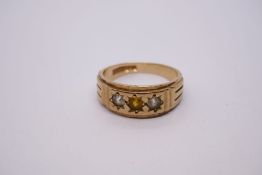 9ct yellow gold gents ring with central yellow stone flanked two clear stones, size W, 6.4g approx