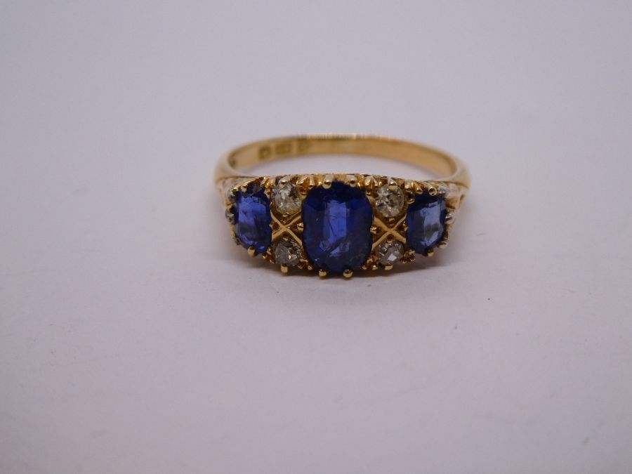 Antique Sapphire and diamond ring with central oval blue sapphire flanked diamonds and smaller oval - Image 9 of 11