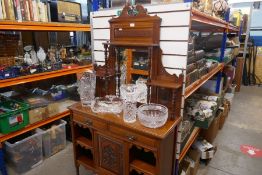 A late Victorian Walnut mirror backed sideboard having carved decoration