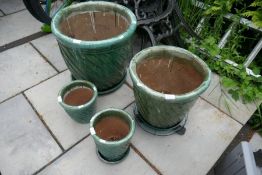 Four green glazed garden pots