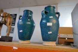 A pair of pottery vases with blue glaze